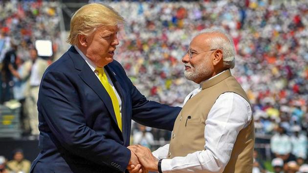 Prime Minister Narendra Modi shakes hands with US President Donald Trump during the 'Namaste Trump' event at Sardar Patel Stadium in Ahmedabad on Monday.(PTI)