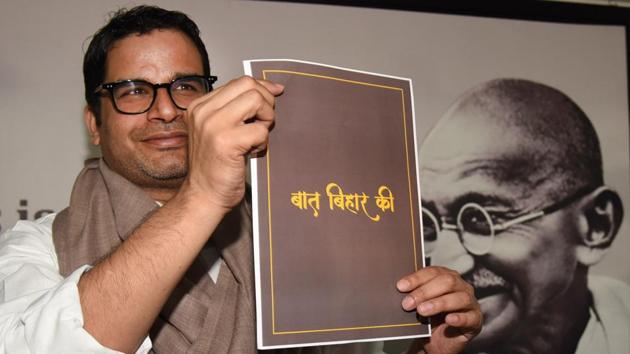 Prashant Kishor shows a document of his campaign at a press conference in Patna, on February 18.(Parwaz Khan /HT Photo)