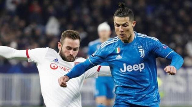 Juventus' Cristiano Ronaldo in action with Olympique Lyonnais' Lucas Tousart.(REUTERS)