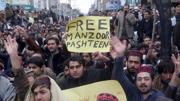 Supporters of Pashtun Tahafuz Movement (PTM) hold signs as they chant slogans during a country-wide protests over the arrest of their leader and student activist Manzoor Pashteen, in Quetta, Pakistan January 28, 2020.(REUTERS)