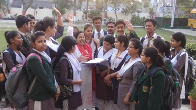Students of St Teresa College with the school teacher after ISC Hindi paper in Lucknow on Friday.(HT photo)