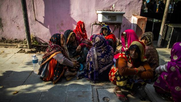 People gather outside the mortuary at the Guru Teg Bahadur Hospital. The scenes captured the grim aftermath of the worst communal violence to hit India’s capital in nearly three decades. At least 42 people died and more than 250 were injured over three days of rioting, according to a report. (Prashanth Vishwanathan / Bloomberg)