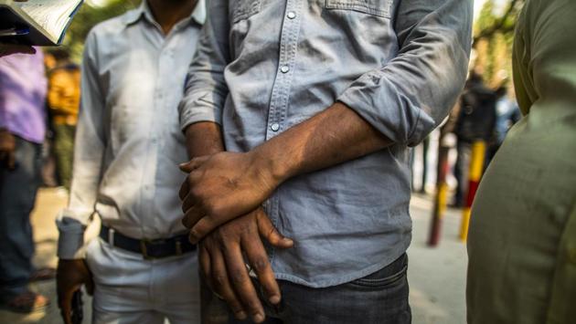 A man who's brother was killed waits outside the mortuary at the Guru Teg Bahadur Hospital. A two-judge bench of the Delhi High Court upbraided the city’s police for not controlling the mobs and directed officers to ensure safe passage of ambulances to hospitals. (Prashanth Vishwanathan / Bloomberg)