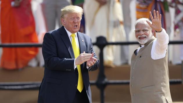 Indian Prime Minister Narendra Modi, right, waves as U.S. President Donald Trump reacts to the crowd during the 'Namaste Trump' event.(AP)