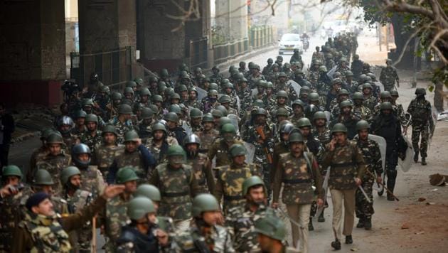 Paramilitary soilders conduct a flag march following clashes over the new citizenship law, at Maujpur, in New Delhi on February 26, 2020.(Amal KS/HT PHOTO) Paramilitary soilders conduct a flag march following clashes over the new citizenship law, at Maujpur, in New Delhi on February 26, 2020.(Amal KS/HT PHOTO)