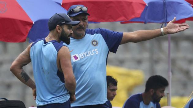 India's cricket coach Ravi Shastri, right, chats with Virat Kohli.(AP)