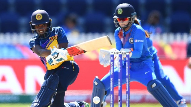 Sri Lanka batwoman plays a sweep shot.