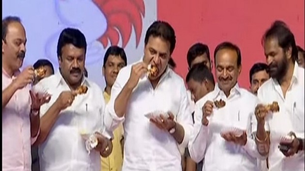Dressed in crisp white shirts and holding fried chicken legs, the ministers were seen at the event organised at Tank Bund area in the city on Friday(ANI)