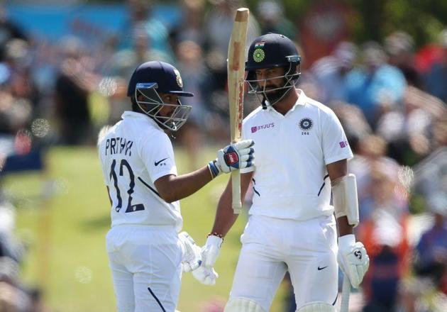 Prithvi Shaw celebrates after completeing his half-century during play on day one of the second cricket test between New Zealand and India at Hagley Oval in Christchurch. (AP)