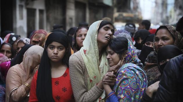 Relatives and neighbors wail near the body of Mohammad Mudasir, 31, who was killed in communal violence in New Delhi, India, Thursday, Feb. 27, 2020. The violent clashes between Hindu and Muslim mobs were the capital's worst communal riots in decades and saw shops, Muslim shrines and public vehicles go up in flames.(AP Photo)