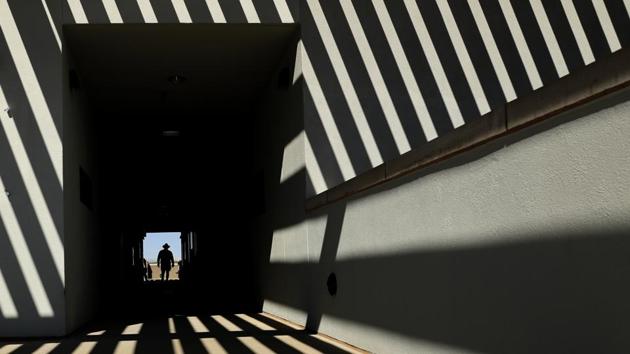 An usher walks along an upper deck concourse before a spring training baseball game between the Cleveland Indians and the San Diego Padres in Peoria, Arizona, USA. (Charlie Riedel / AP)