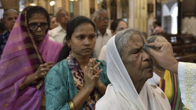 A Catholic priest marks the symbol of the cross with ash on the forehead of a devotee during an Ash Wednesday service at cathedral church, Colaba, in Mumbai. (Satish Bate / HT Photo) A Catholic priest marks the symbol of the cross with ash on the forehead of a devotee during an Ash Wednesday service at cathedral church, Colaba, in Mumbai. (Satish Bate / HT Photo)