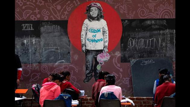A wall mural seen as students attend a class under a Delhi Metro bridge at the Free School Under the Bridge, a school that provides free-to-cost classes to children from low income areas, in New Delhi. (Laurène Becquart / AFP) A wall mural seen as students attend a class under a Delhi Metro bridge at the Free School Under the Bridge, a school that provides free-to-cost classes to children from low income areas, in New Delhi. (Laurène Becquart / AFP)