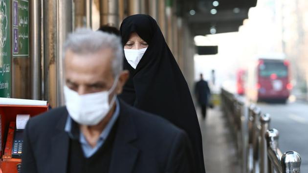 Iranian people wear protective masks to prevent contracting a coronavirus, in Tehran, February 29, 2020.(via REUTERS)