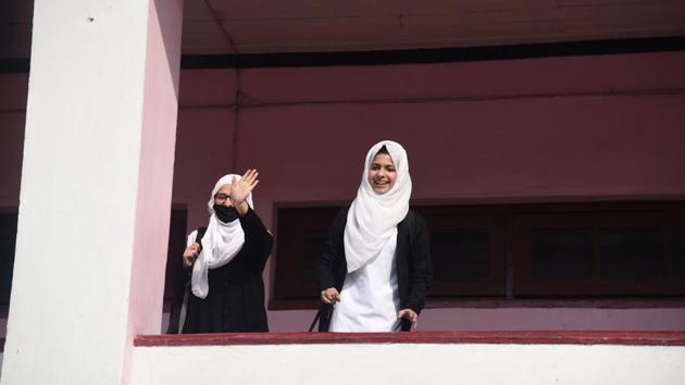 Students gesture as their school reopens in Srinagar, Jammu and Kashmir. Schools in Kashmir reopened on Monday, February 24, after almost seven months. (Waseem Andrabi / HT Photo) Students gesture as their school reopens in Srinagar, Jammu and Kashmir. Schools in Kashmir reopened on Monday, February 24, after almost seven months. (Waseem Andrabi / HT Photo)