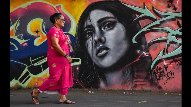 A woman walks past a wall mural near Rizwi College at Carter Road in Mumbai. (Shashi S Kashyap / HT Photo ) A woman walks past a wall mural near Rizwi College at Carter Road in Mumbai. (Shashi S Kashyap / HT Photo )