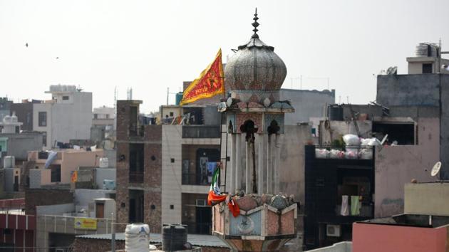 A view of Badi Masjid that was burnt by miscreants during clashes over the new citizenship law at Ashok Nagar, in New Delhi. A flag with Hindu religious deity is also seen on top of the Masjid. (Amal KS / HT Photo) A view of Badi Masjid that was burnt by miscreants during clashes over the new citizenship law at Ashok Nagar, in New Delhi. A flag with Hindu religious deity is also seen on top of the Masjid. (Amal KS / HT Photo)