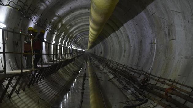 Workers at the underground station of Metro Line 3, below Mithi River at Bandra Kurla Complex Station in Mumbai. (Anshuman Poyrekar / HT Photo) Workers at the underground station of Metro Line 3, below Mithi River at Bandra Kurla Complex Station in Mumbai. (Anshuman Poyrekar / HT Photo)
