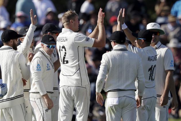 New Zealand players celebrate the dismissal of India's Cheteshwar Pujara during play on day one of the second cricket test between New Zealand and India at Hagley Oval in Christchurch (AP)