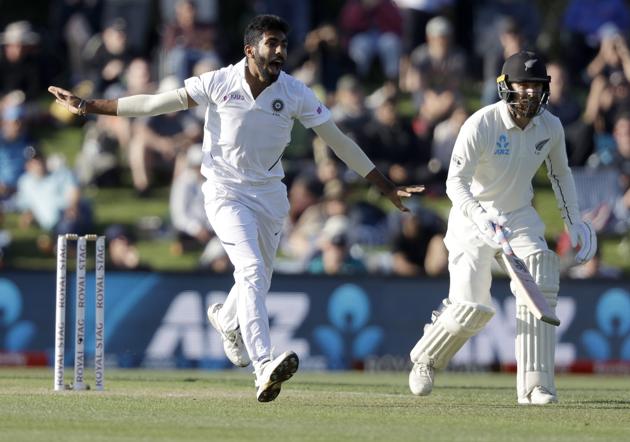 India's Jasprit Bumrah reacts as he bowls to New Zealand's Tom Latham, not pictured, as Tom Blundell, right, watches during play on day one of the second cricket test between New Zealand and India at Hagley Oval in Christchurch. (AP)