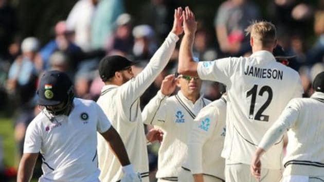 New Zealand's Kyle Jamieson celebrates with teammates after taking a wicket.(REUTERS)
