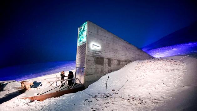 Representatives from various countries and universities arrive in the Svalbard's global seed vault with new seeds, in Longyearbyen, Norway. (Lise Aserud / REUTERS)