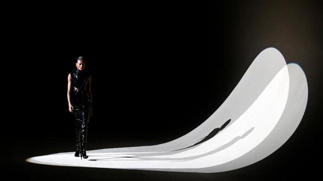 A model presents a creation by designer Anthony Vaccarello as part of his Fall/Winter 2020/21 women's ready-to-wear collection show for fashion house Saint Laurent during Paris Fashion Week in Paris, France. (Piroschka van de Wouw / REUTERS)