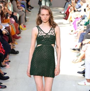 A model walks the runway in a deep-green crochet dress during the Salvatore Ferragamo show at Milan Fashion Week.(Getty Images)