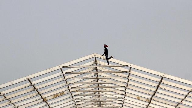 A labourer works in the assembling of a temporary structure for an event in Allahabad, Uttar Pradesh. (Sanjay Kanojia / AFP) A labourer works in the assembling of a temporary structure for an event in Allahabad, Uttar Pradesh. (Sanjay Kanojia / AFP)