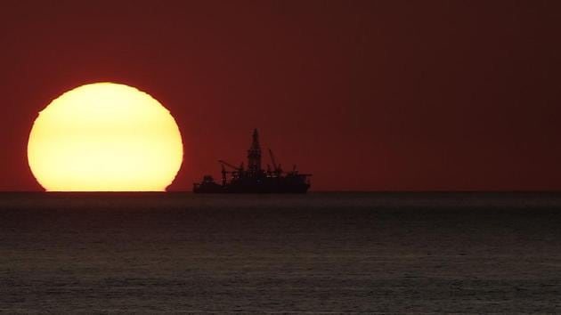 Oil drilling ship Tungsten Explorer is docked at the block 4 area off the coast of the Lebanese coastal town of Safra during sunset. (Joseph Eid / AFP)