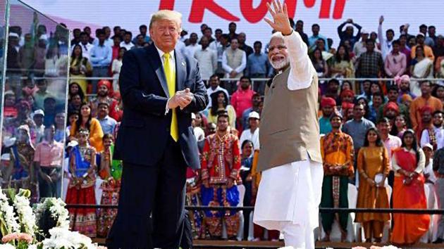Prime Minister Narendra Modi and US President Donald Trump wave the crowd, as they arrive for the ‘Namaste Trump’ event at Motera Stadium in Ahmedabad on Monday.(ANI photo)