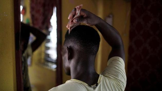 Months after -- Smart Joel, 25, one of the men arrested is seen inside his house in Lagos. During the raids, Lagos state police commissioner Imohimi Edgal, told the gathered journalists that he personally had ordered the raid that swept up the men after the authorities received a tipoff that young men were being initiated into a “homosexual club.” (Temilade Adelaja / REUTERS) 
