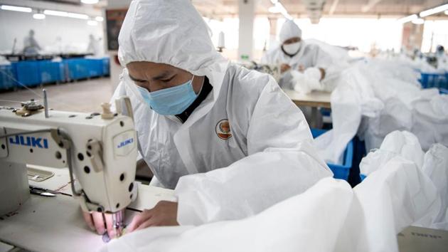 “As soon as we received this mission, we reorganised our production line within 60 hours,” company president Pan Yue told AFP. The suits are sold to the government at cost and intended for local epidemic-control efforts. But with the virus now hitting other countries, the company plans to continue hazmat suit production even after normal operations resume as expected in the coming weeks. (Noel Celis / AFP) “As soon as we received this mission, we reorganised our production line within 60 hours,” company president Pan Yue told AFP. The suits are sold to the government at cost and intended for local epidemic-control efforts. But with the virus now hitting other countries, the company plans to continue hazmat suit production even after normal operations resume as expected in the coming weeks. (Noel Celis / AFP)