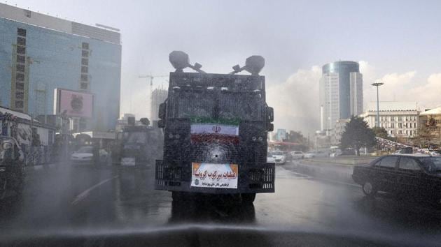 A police vehicle disinfects streets against coronavirus in Tehran, Iran. Indian government is taking all steps necessary to evacuate its citizens from Iran. The death due to covid-19 in Iran has now risen to 54. 978 people are affected. (AP) A police vehicle disinfects streets against coronavirus in Tehran, Iran. Indian government is taking all steps necessary to evacuate its citizens from Iran. The death due to covid-19 in Iran has now risen to 54. 978 people are affected. (AP)