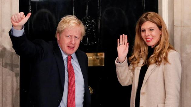 Britain's Prime Minister Boris Johnson and his girlfriend Carrie Symonds gesture as they arrive at 10 Downing Street. (REUTERS) Britain's Prime Minister Boris Johnson and his girlfriend Carrie Symonds gesture as they arrive at 10 Downing Street. (REUTERS)