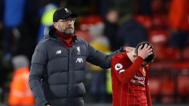 Liverpool manager Juergen Klopp and Andrew Robertson look dejected at the end of the match(REUTERS) Liverpool manager Juergen Klopp and Andrew Robertson look dejected at the end of the match(REUTERS)