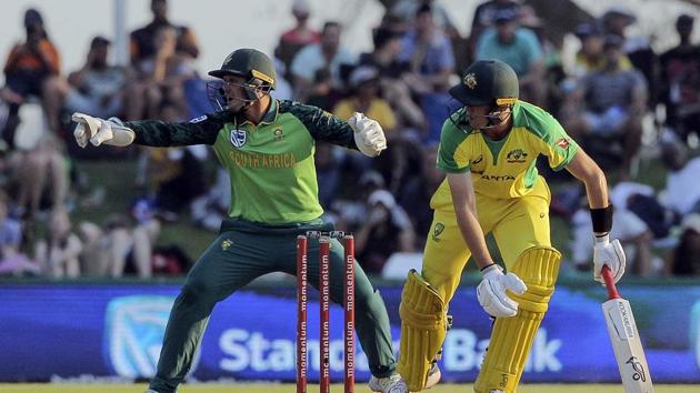 South African wicketkeeper Quinton De Kock, left, points toward the ball while Australian batsman Marnus Labuschagne watches on during the ODI cricket match between South Africa and Australia in Paarl, South Africa, Saturday, Feb. 29, 2020. (AP Photo/Halden Krog)(AP)