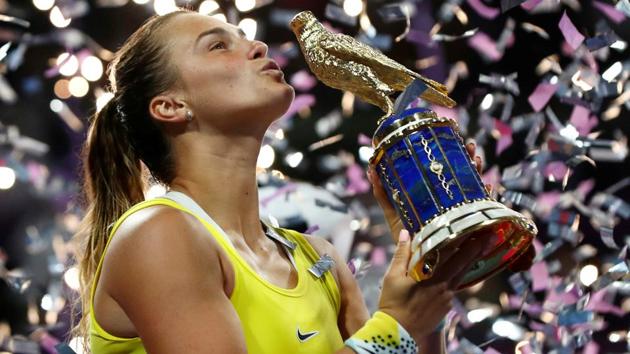 Belarus' Aryna Sabalenka celebrates with the trophy after winning the final against Czech Republic's Petra Kvitova.(REUTERS) Belarus' Aryna Sabalenka celebrates with the trophy after winning the final against Czech Republic's Petra Kvitova.(REUTERS)