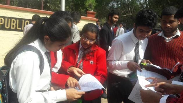 Students of GD Goenka Public School, Lucknow discussing their class 12 physics question paper after the examination in Lucknow on Monday.(Hand out)