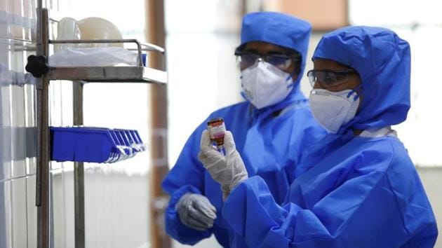 Medical staff with protective clothing are seen inside a ward specialised in receiving any person who may have been infected with coronavirus, at the Rajiv Ghandhi Government General hospital in Chennai in this file photo.(Reuters Photo)