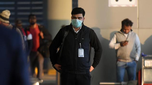 People cover their faces with facemasks amid Coronavirus scare, at Indira Gandhi International Airport, in New Delhi. (Amal KS/HT PHOTO) People cover their faces with facemasks amid Coronavirus scare, at Indira Gandhi International Airport, in New Delhi. (Amal KS/HT PHOTO)