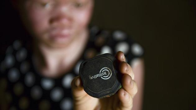 Catherine Amidu shows her protective alarm inside her home. The protective alarm she received in October had not been working for close to two weeks, she said. She now sees the new keychain-like alarm as the best way to alert others in case of another attack. “Without it, it means I don’t have protection at all,” she said. “What will I do when the people return to finish what they started?” (Thoko Chikondi / AP) Catherine Amidu shows her protective alarm inside her home. The protective alarm she received in October had not been working for close to two weeks, she said. She now sees the new keychain-like alarm as the best way to alert others in case of another attack. “Without it, it means I don’t have protection at all,” she said. “What will I do when the people return to finish what they started?” (Thoko Chikondi / AP)