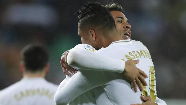 Real Madrid's Mariano Diaz, center, celebrates with Casemiro after scoring their side's second goal.(AP) Real Madrid's Mariano Diaz, center, celebrates with Casemiro after scoring their side's second goal.(AP)