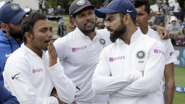 India's Virat Kohli, right, talks with his teammates(AP)