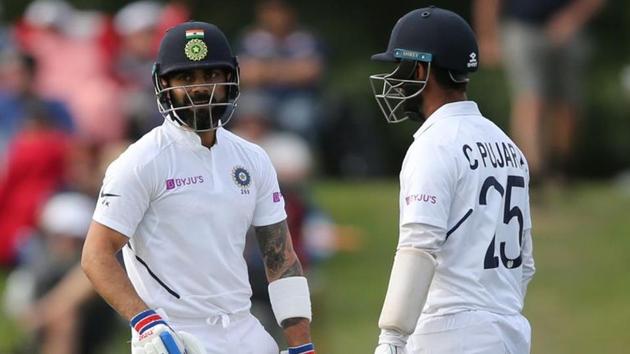 India's Virat Kohli and Cheteshwar Pujura during the match.(REUTERS) India's Virat Kohli and Cheteshwar Pujura during the match.(REUTERS)