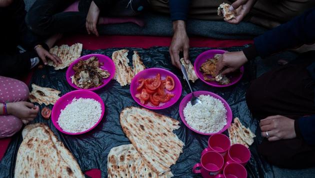 The Hosini family eat lunch inside a temporary shelter. The couple will not let their daughters venture out of the shelter alone, fearing they will be assaulted or kidnapped. (Alkis Konstantinidis / REUTERS) The Hosini family eat lunch inside a temporary shelter. The couple will not let their daughters venture out of the shelter alone, fearing they will be assaulted or kidnapped. (Alkis Konstantinidis / REUTERS)