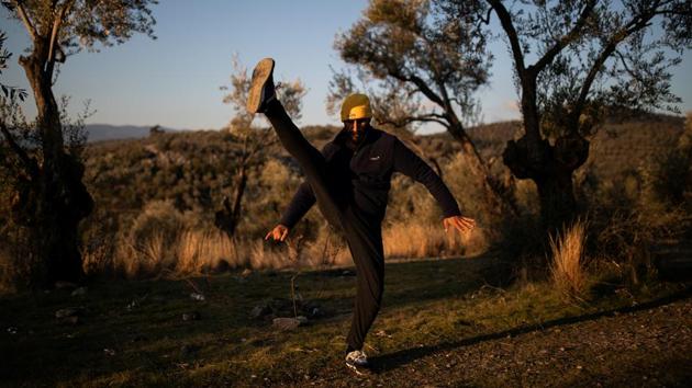 Hosini practices kung fu at a makeshift camp. His family’s asylum interview is not for another year-and-a-half. Tears well up in his eyes when he is asked what he will do if the application is rejected. “It is hard to say, very hard to say because if our case isn’t accepted here and we have to go back to Afghanistan, what will I do in Afghanistan? If we go back my children’s futures are ruined,” he said through tears. (Alkis Konstantinidis / REUTERS) Hosini practices kung fu at a makeshift camp. His family’s asylum interview is not for another year-and-a-half. Tears well up in his eyes when he is asked what he will do if the application is rejected. “It is hard to say, very hard to say because if our case isn’t accepted here and we have to go back to Afghanistan, what will I do in Afghanistan? If we go back my children’s futures are ruined,” he said through tears. (Alkis Konstantinidis / REUTERS)