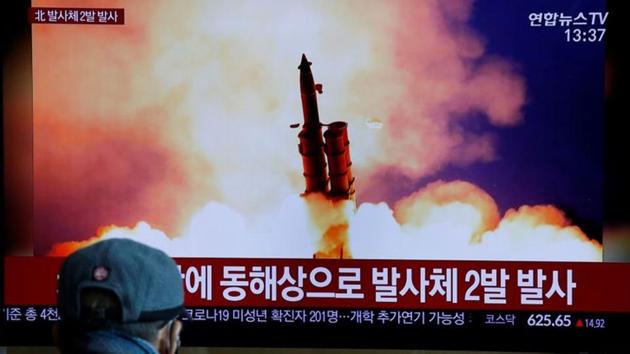 A man watches a TV showing a file picture for a news report on North Korea firing two unidentified projectiles, in Seoul, South Korea, March 2, 2020. (REUTERS)
