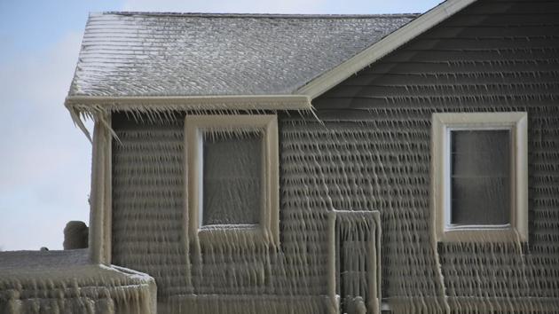 A house along Hoover Beach is covered by ice from high winds and from the waves from Lake Erie. (AP) A house along Hoover Beach is covered by ice from high winds and from the waves from Lake Erie. (AP)