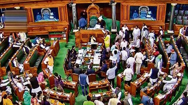 Opposition members protest in the Lok Sabha during the budget session of Parliament on Monday. (PTI) Opposition members protest in the Lok Sabha during the budget session of Parliament on Monday. (PTI)